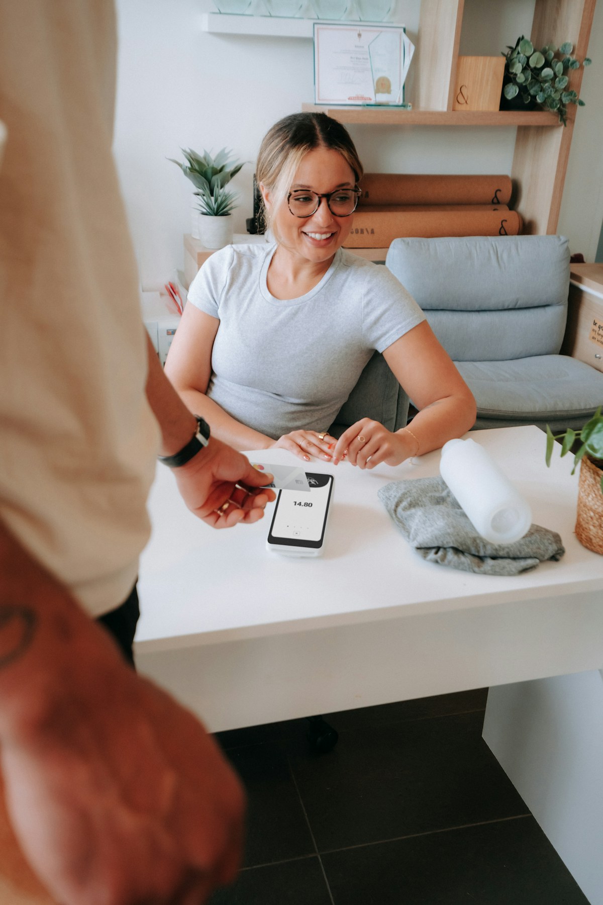 Retail merchant helping a customer